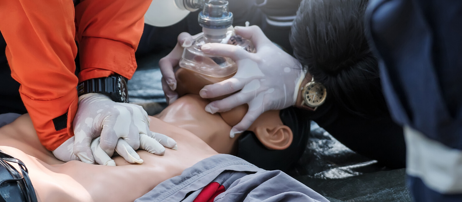 People practicing CPR training on mannequin